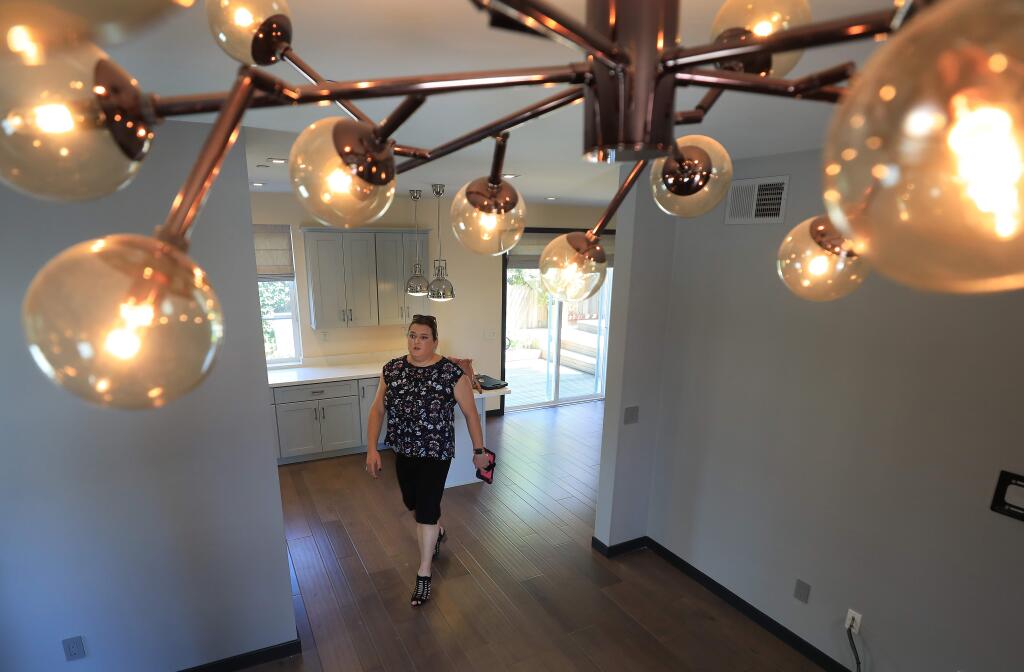 DeDe's Rentals & Management property manager Jenny Rihl, makes a walk through of a rental home in Santa Rosa, Wednesday, Aug. 21, 2019. (Kent Porter / The Press Democrat) 2019