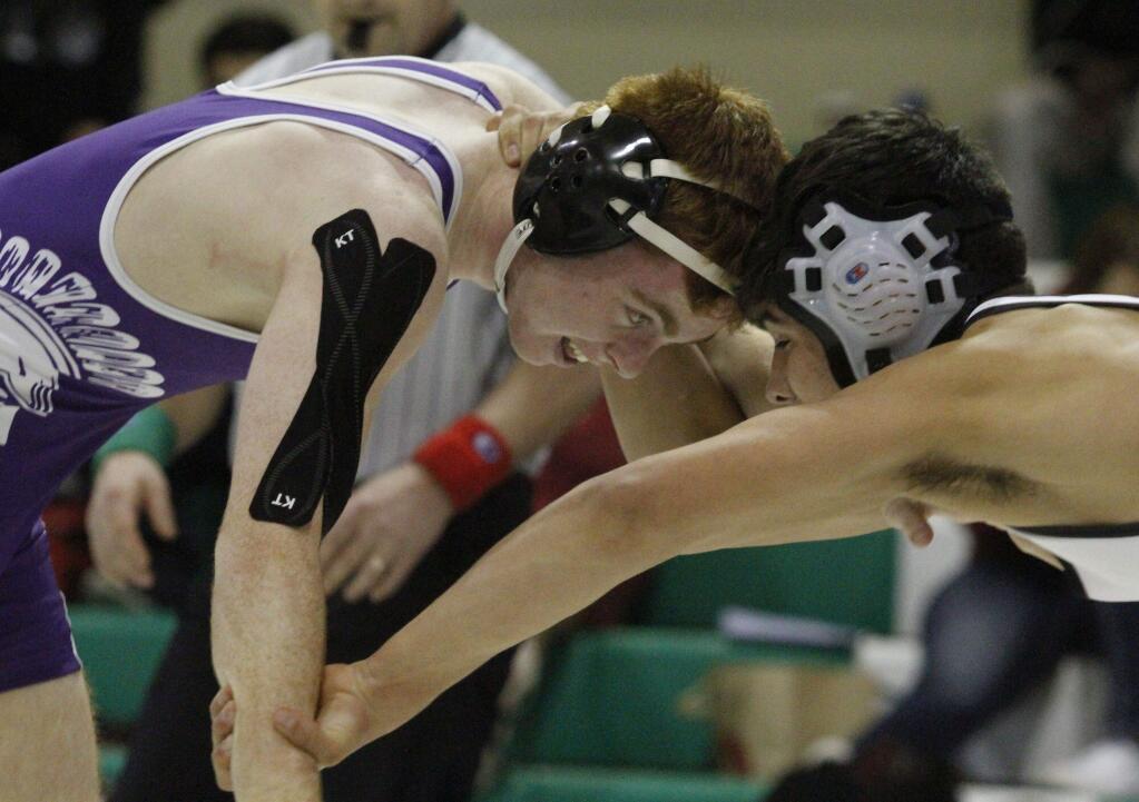 BILL HOBAN/SONOMA-INDEX TRIBUNE STAFFPetaluma's Jack Reynolds went head-to-head with Sonoma's AJ Vasquez in the finals of the 134-pound weight class in the SCL Championships.