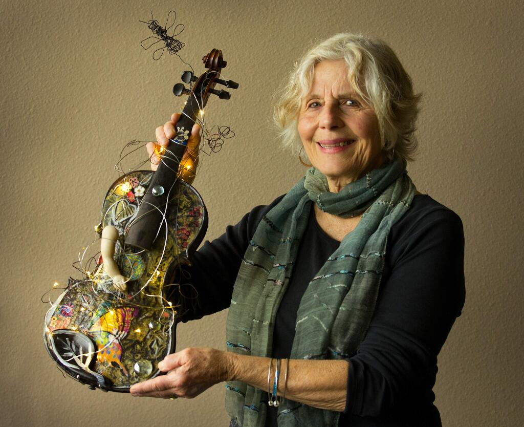 Artist Marylu Downing created this violin for the Santa Rosa Symphony League fundraiser for the Santa Rosa Youth Orchestra's trip to Europe. (Photo by John Burgess/The Press Democrat)