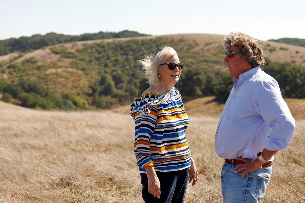 Sonoma County 1st District supervisor Susan Gorin, left, talks with Justin Faggioli, brother-in-law of property owner Bruce Donnell, during a tour of Donnell Ranch, a 978-acre property that was recently preserved from development, near Sonoma, California, on Friday, Sept. 7, 2018. (ALVIN JORNADA/ PD)