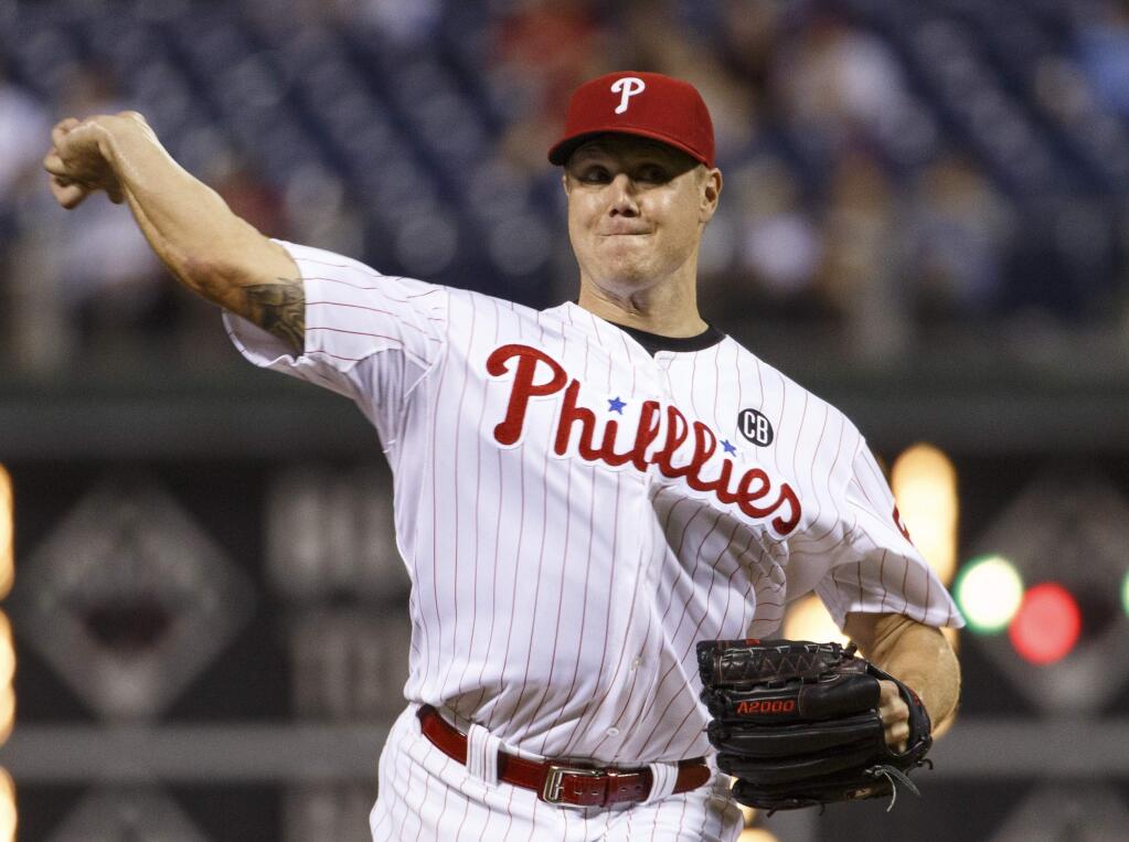 Philadelphia Phillies relief pitcher Jonathan Papelbon pitches during the ninth inning of a baseball game against the San Francisco Giants, Wednesday, July 23, 2014, in Philadelphia. The Giants won 3-1. (AP Photo/Chris Szagola)
