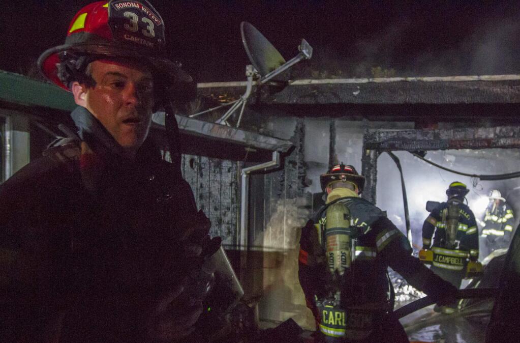 On Tuesday, Dec. 27, Sonoma Valley and Schell-Vista fire departments responded to a fire at a marijuana grow operation on Olive Avenue at 6:21 p.m. The fire agencies prevented the fire from spreading to the house, but a garage and two sheds were destroyed. (Photo by Robbi Pengelly/Index-Tribune