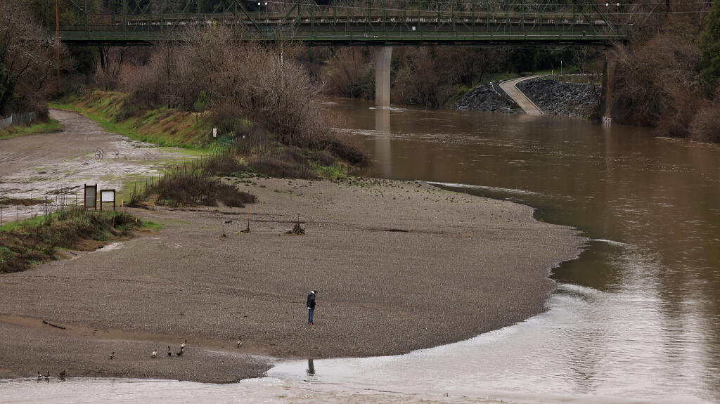 The Russian River at Johnson’s Beach in Guerneville has receded from the weekend storm, but is forecast to rise to flood stage during the incoming winter storm, Tuesday, Jan. 3, 2023. (Kent Porter / The Press Democrat) 2023