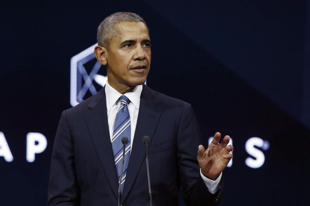 Former U.S. President Obama gives a speech, in Paris, Saturday, Dec. 2, 2017. Former U.S. President Barack Obama is ending a five-day international trip in Paris, where he is lunching with French President Emmanuel Macron and scheduled to give a speech to business leaders. (AP Photo/Thibault Camus)