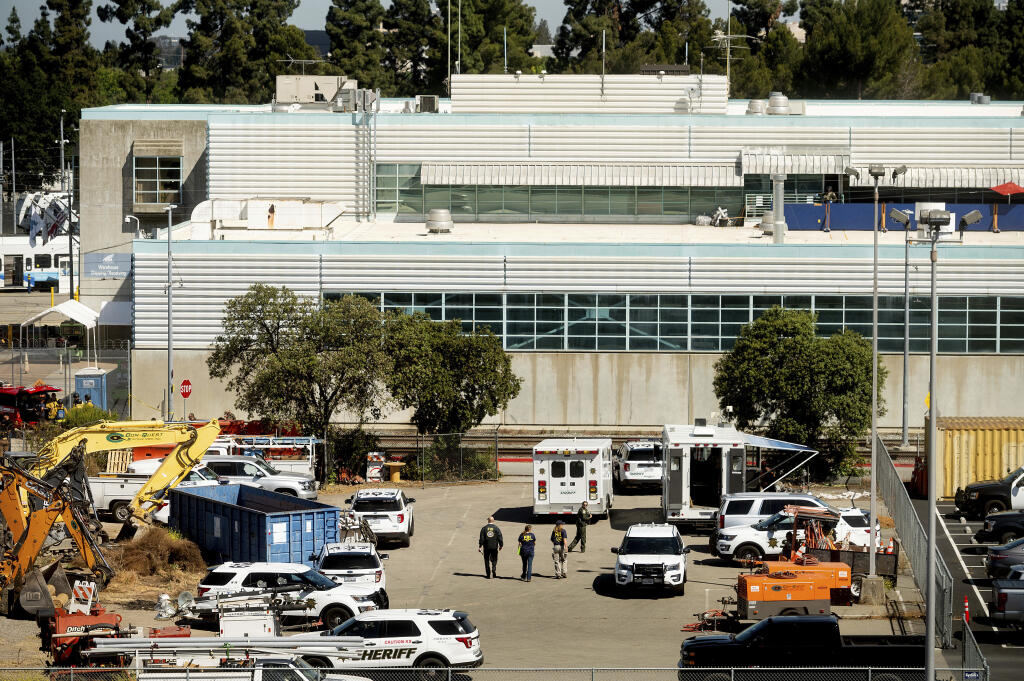 FILE - In this May 26, 2021, file photo, law enforcement officers respond to the scene of a shooting at a Santa Clara Valley Transportation Authority (VTA) facility in San Jose, Calif. A gunman who killed nine co-workers at a California rail yard last month was the subject of four investigations into his workplace conduct, according to internal documents published Thursday, June 10, 2021. (AP Photo/Noah Berger, File)