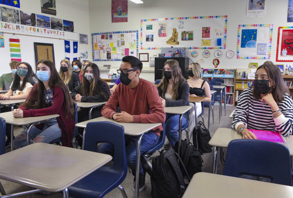 Masked students listen during Melanie Barker’s French class on the first day of the new school year on Tuesday, Aug. 17, 2021 at Petaluma High School in Petaluma, California. (Crissy Pascual / Argus-Courier)