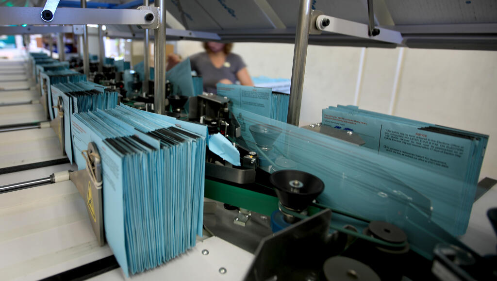 Mail-in ballots are sorted into stacks on a signature verification system, Wednesday, Nov. 4, 2020, at the Sonoma County Registrar of Voters in Santa Rosa. (Kent Porter / The Press Democrat) 2020