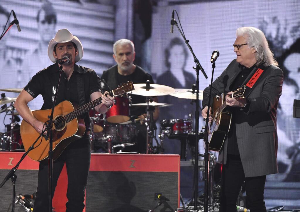 Brad Paisley, left, and Ricky Skaggs perform at the 52nd annual CMA Awards at Bridgestone Arena on Wednesday, Nov. 14, 2018, in Nashville, Tenn. (Photo by Charles Sykes/Invision/AP)