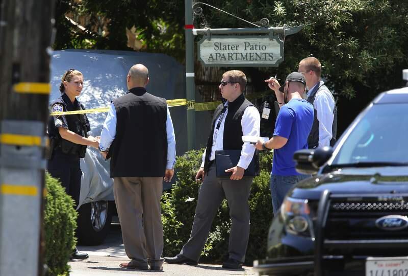 Santa Rosa Police Department personnel investigating the Slater Street scene of of the homicides of two children, ages 6 and 19 months, by their father in June in his apartment. Investigators say Alvaro Botelho da Camara, 40, committed suicide. (CHRISTOPHER CHUNG/The Press Democrat)