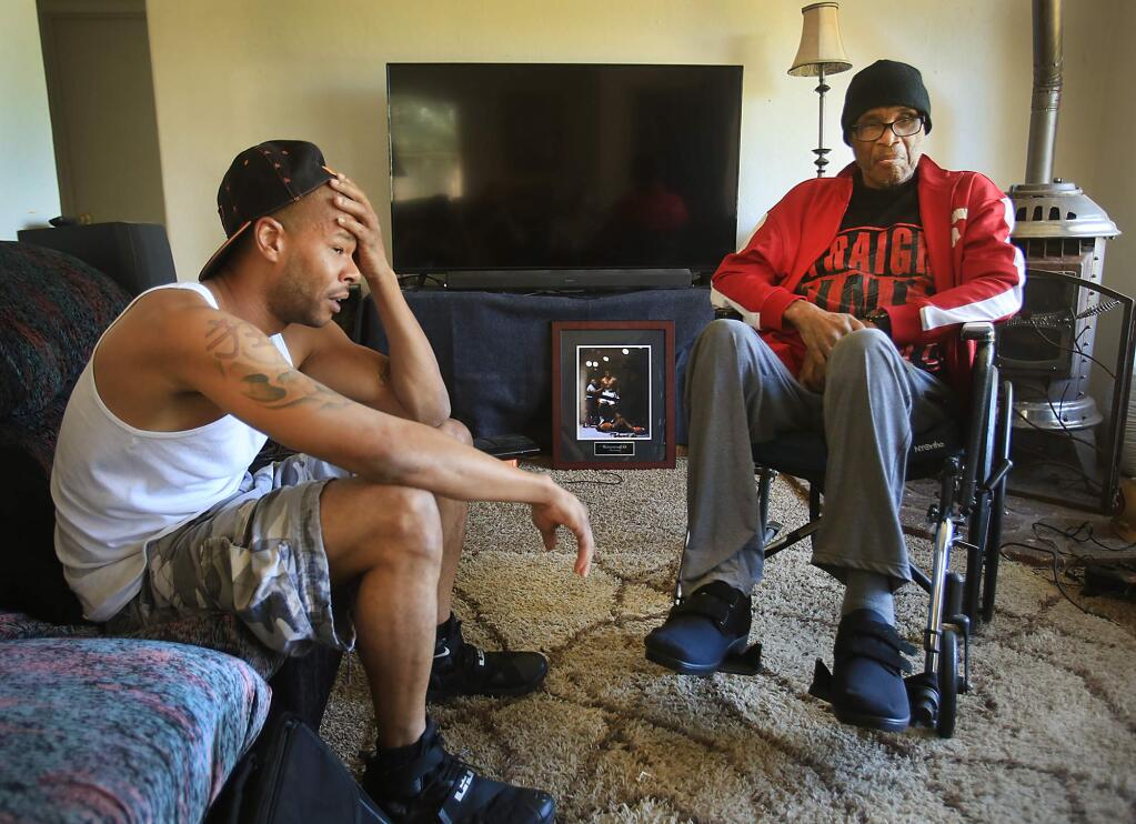 At home in Lake County, Ko'Fawn Jones is now the full-time caretaker for his father, Luther Jones, right, after his father was released after spending the last 20 years incarcerated for a molestation crime he did not commit. (Kent Porter / Press Democrat)