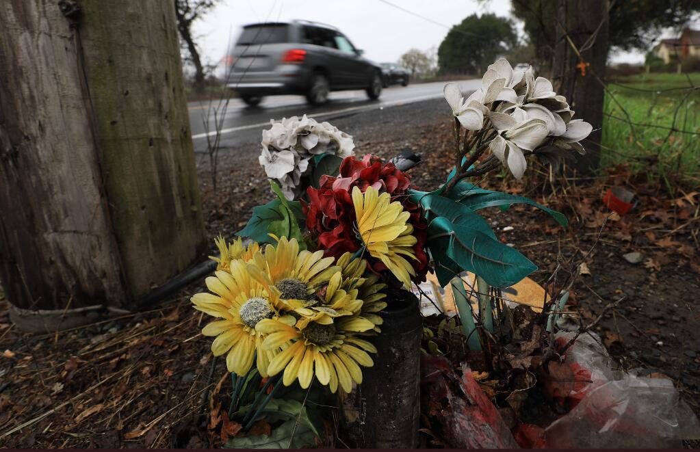 A memorial for Ihab Halaweh, 20, who died in a motorcycle crash in 2015 at Piezzi Lane and Occidental Road is a stark reminder of the hazards of Occidental Road. (KENT PORTER / The Press Democrat)