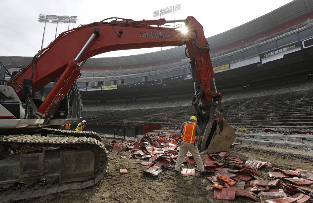 Members of the media photograph from the field of Candlestick Park Wednesday, Feb. 4, 2015, in San Francisco. (AP Photo/Ben Margot)