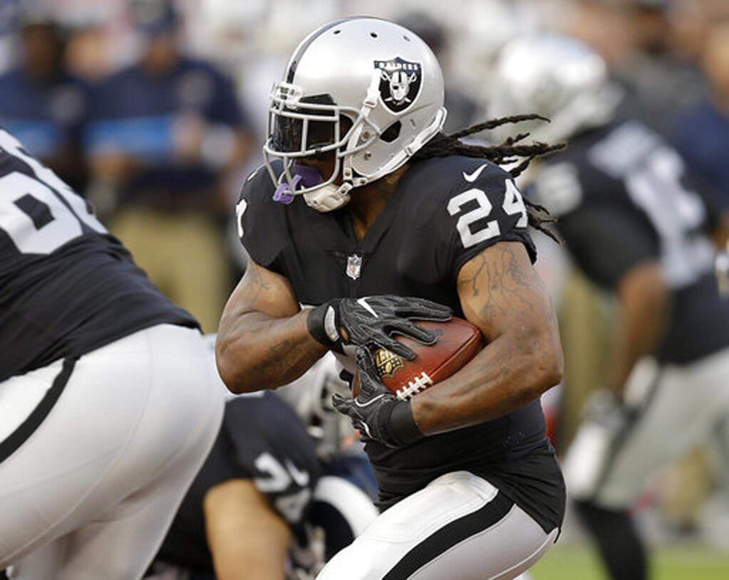 In this Aug. 19, 2017, file photo, Oakland Raiders running back Marshawn Lynch runs against the Los Angeles Rams during the first half of a preseason game in Oakland. (AP Photo/Ben Margot, File)