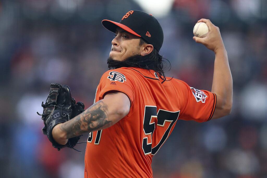 San Francisco Giants pitcher Dereck Rodriguez works against the St. Louis Cardinals during the first inning of a baseball game Friday, July 6, 2018, in San Francisco. (AP Photo/Ben Margot)