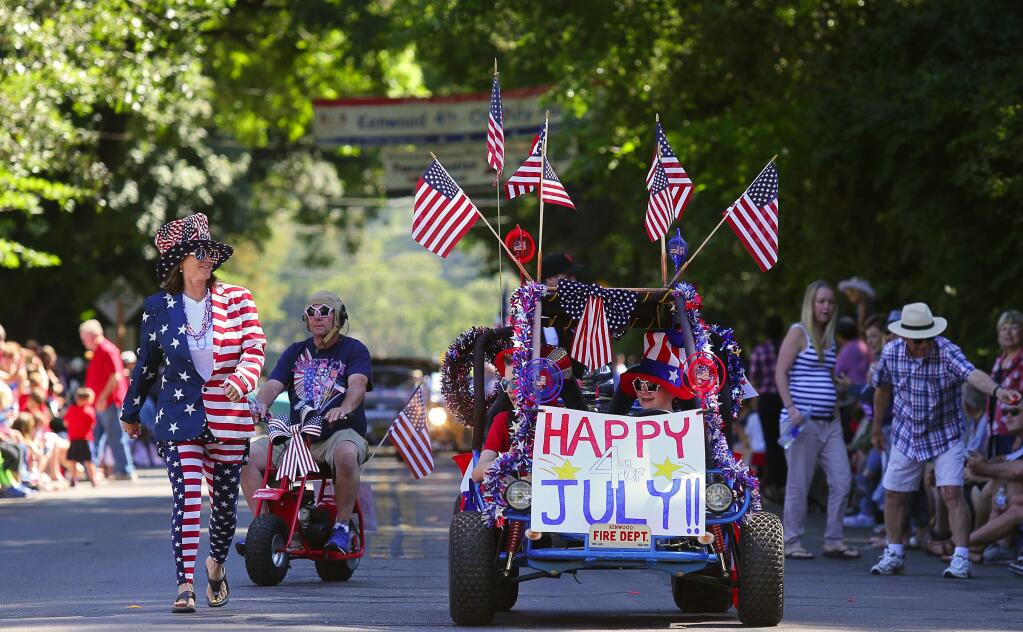 Stacy Allegro, left, Scott Lane, Dillon Clower and Cameron Lane participate in the Kenwood 4th of July Hometown Parade, in Kenwood, on Monday, July 4, 2016. (Christopher Chung/ The Press Democrat)