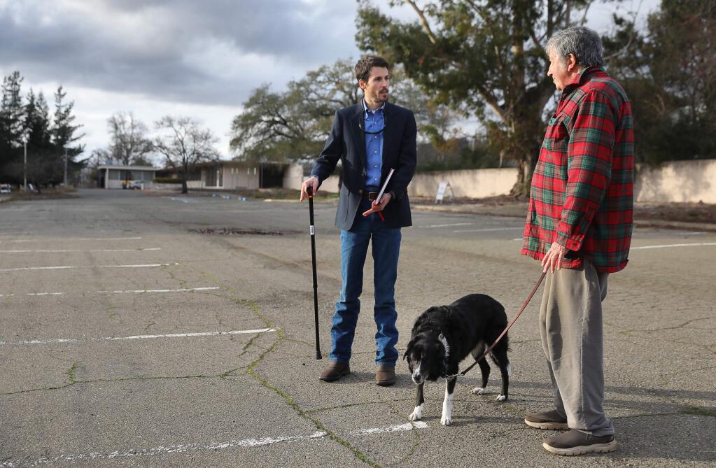 Santa Rosa City Councilman Jack Tibbetts , left, talks with Richard Shore, a resident of nearby Oakmont, at the site selected by the Sonoma County Board of Supervisors for a temporary homeless camp at the county's Los Guilicos campus, in Santa Rosa on Wednesday, January 15, 2020. Tibbetts is the executive director of St. Vincent de Paul Sonoma County, which is the group contracted to oversee the camp. (Christopher Chung/ The Press Democrat)