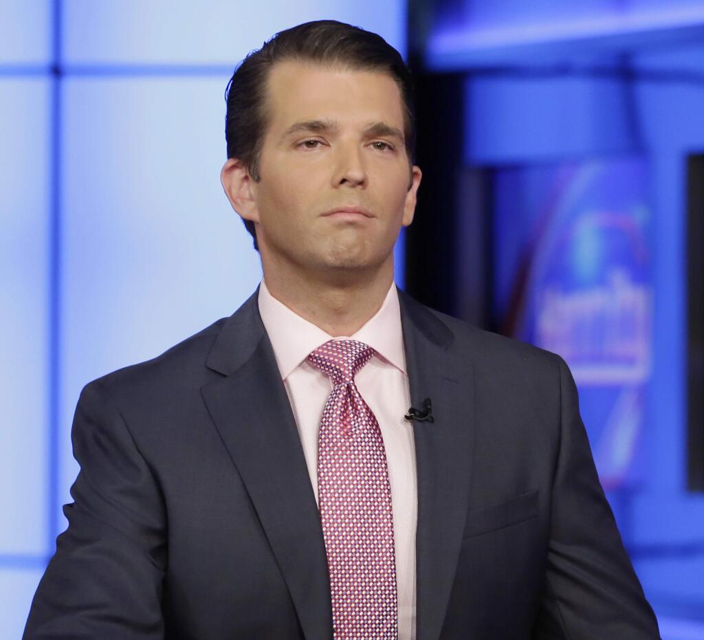 FILE - In this July 11, 2017, file photo, Donald Trump Jr. is interviewed by host Sean Hannity on his Fox News Channel television program, in New York. (AP Photo/Richard Drew)