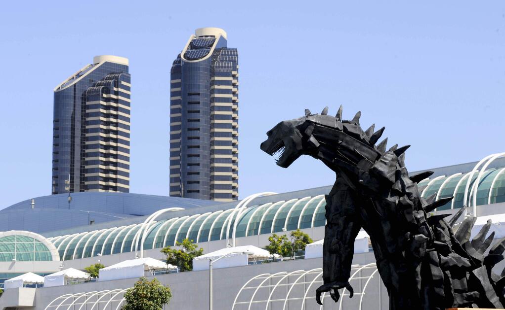 A huge Godzilla statue built to promote the 'Godzilla' movie sits behind the convention center on day 1 of the 2014 Comic-Con International Convention held Thursday, July 24, 2014 in San Diego. (Photo by Denis Poroy/Invision/AP)