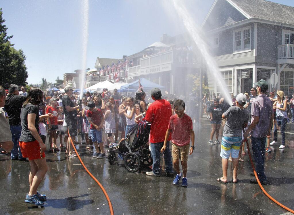 The Sonoma Volunteer Firefighters' Association, in their first year of sponsoring Sonoma annual July 4 parade, brought back a crowd favorite - the splash zone on First Street West and West Spain Street as the last entry passed.Photos by Bill Hoban/Index-Tribune