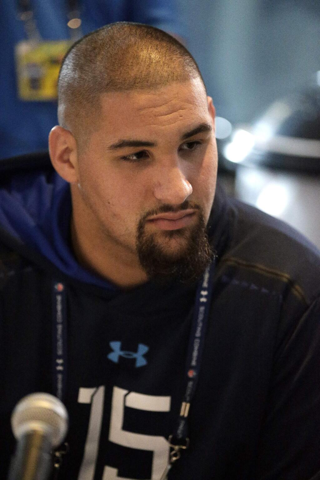 Miami offensive lineman Jon Feliciano answers a question during a news conference at the NFL football scouting combine in Indianapolis, Thursday, Feb. 19, 2015. (AP Photo/David J. Phillip)