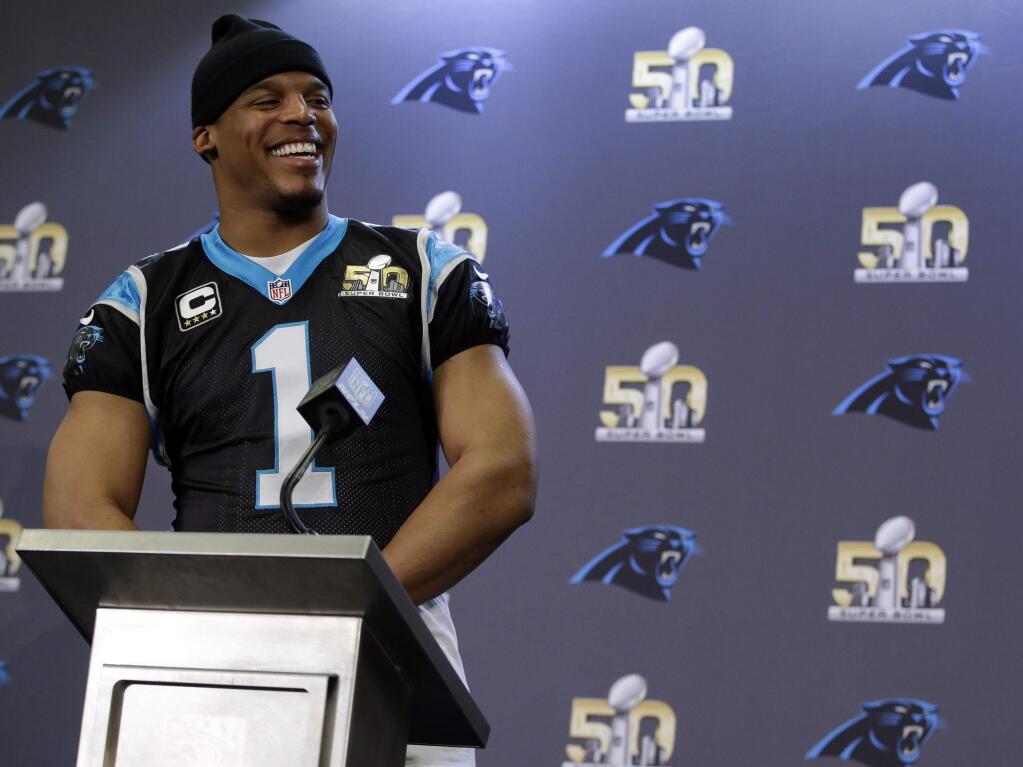 Carolina Panthers quarterback Cam Newton smiles as he fields questions during a press conference in preparation for the Super Bowl, Thursday Feb. 4, 2016 in San Jose. (AP Photo/Marcio Jose Sanchez)