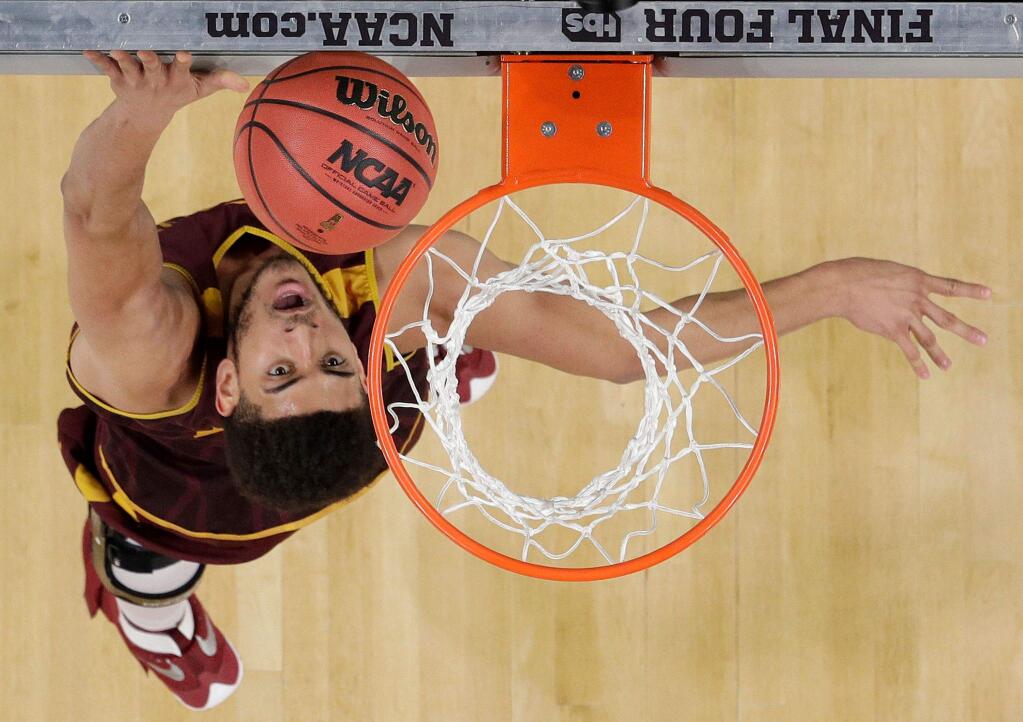 Loyola-Chicago's Christian Negron goes up for a basket during a practice session for the Final Four, Friday, March 30, 2018, in San Antonio. (AP Photo/David J. Phillip)