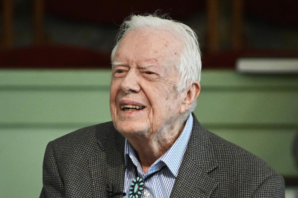 FILE - In this Nov. 3, 2019 file photo, former President Jimmy Carter teaches Sunday school at Maranatha Baptist Church in Plains, Ga. Deanna Congileo, a spokeswoman for The Carter Center, said Monday, Dec. 2, 2019 in a statement that the 95-year-old former president was admitted to Phoebe Sumter Medical Center in Americus over the weekend. (AP Photo/John Amis, File)