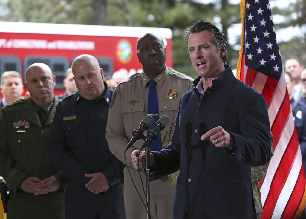 Gov. Gavin Newsom discusses emergency preparedness Tuesday during a visit to the Cal Fire station in Colfax. (RICH PEDRONCELLI / Associated Press)