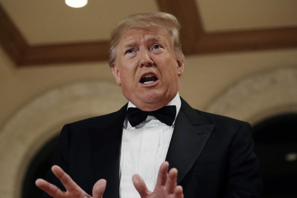 President Donald Trump speaks to the media about the situation at the U.S. embassy in Baghdad, from his Mar-a-Lago property, Tuesday, Dec. 31, 2019, in Palm Beach, Fla. (AP Photo/ Evan Vucci)