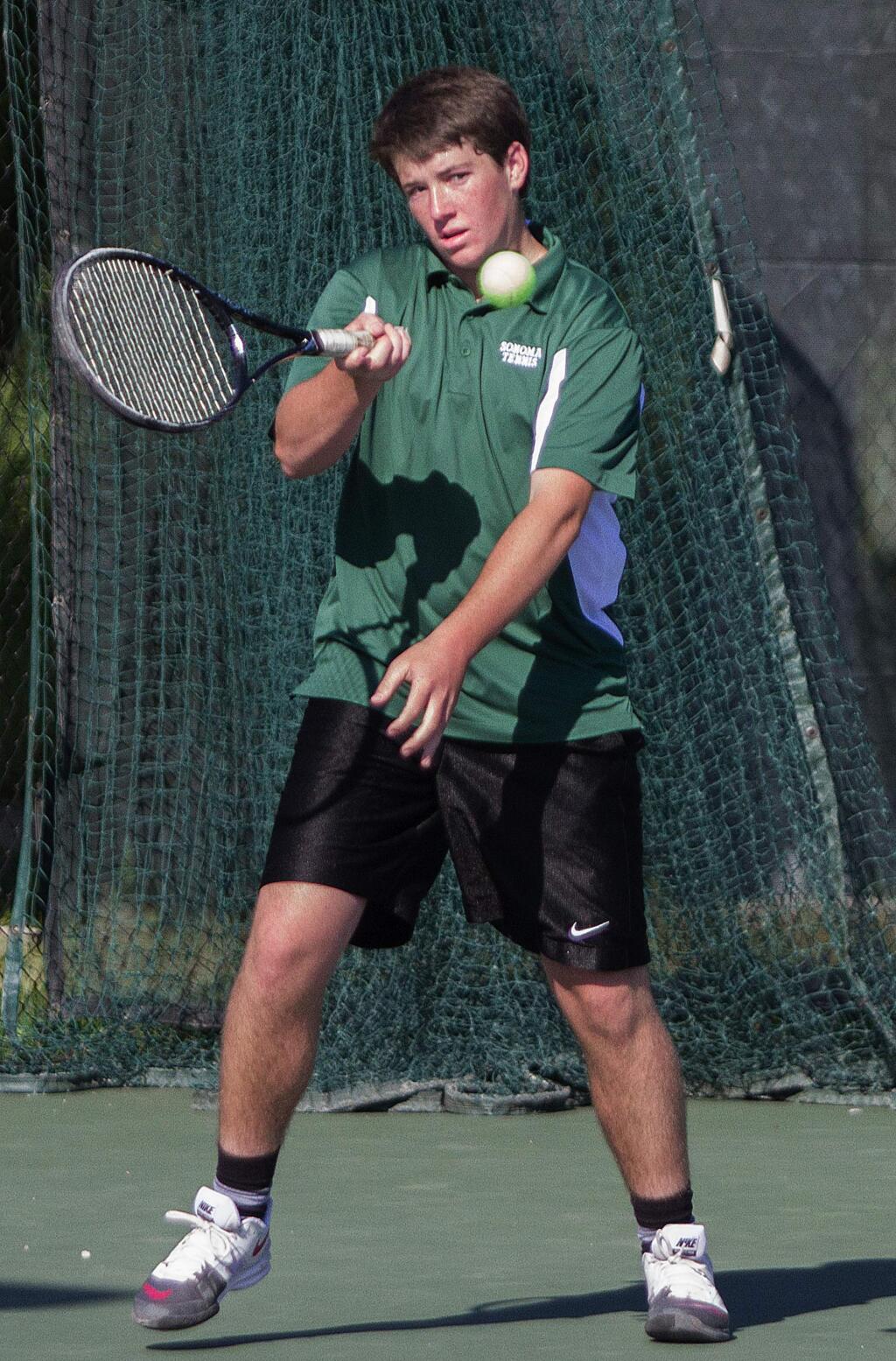 Robbi Pengelly/Index-Tribunesophomore Matt McKale sizes up a return shot en route to recently winning his singles match during the Dragons' shutout of SCL foe Healdsburg on the high school courts.