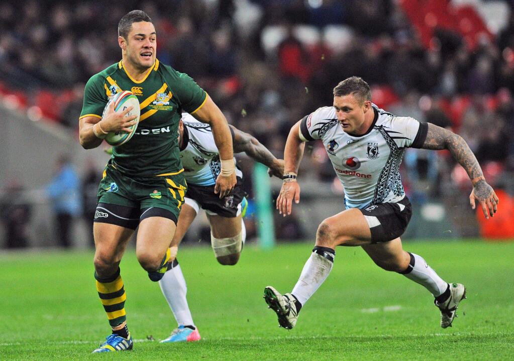 Australia's Jarryd Hayne beats the Fiji defense to score a try during their a Rugby League World Cup semifinal match at London's Wembley Stadium on Nov. 23, 2013. (Anna Gowthorpe / Associated Press)