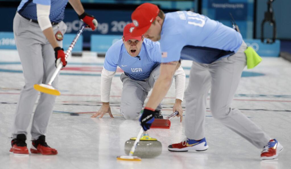 United States skip John Shuster, center, makes a call during the men's final curling match against Sweden at the 2018 Winter Olympics in Gangneung, South Korea, Saturday, Feb. 24, 2018. (AP Photo/Natacha Pisarenko)