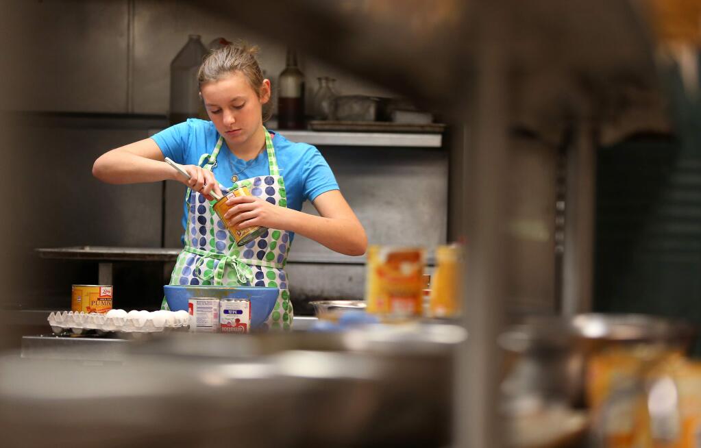 Kati Hilario works on baking pies at the Fountaingrove Inn's kitchen in Santa Rosa in 2013. (CHRISTOPHER CHUNG/ PD FILE)