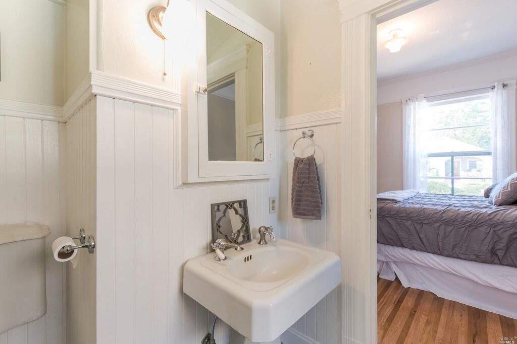 Wainscoting and a pedestal sink at 843 B St, Petaluma. Property listed by Donna Nordby/Terra Firma Global Partners, 800-681-1361. (Photo courtesy of BAREIS MLS