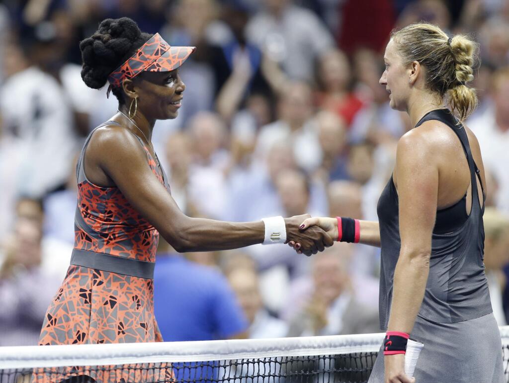 Venus Williams, left, of the United States, left, greets Petra Kvitova, of the Czech Republic, Williams' 6-3, 3-6, 7-6 (2) win in a quarterfinal at the U.S. Open tennis tournament in New York, Tuesday, Sept. 5, 2017. (AP Photo/Kathy Willens)