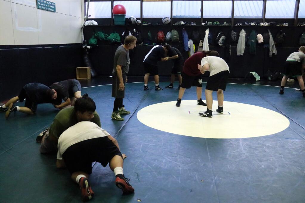 Sonoma Valley wrestlers practice their skills in 'the Pit' on the school campus under the watch of coaches and assistants. The varsity and JV wrestling seasons are just beginning, with the first league dual scheduled for Thursday, Dec. 19, against Vintage at SVHS. (Christian Kallen/Index-Tribune)