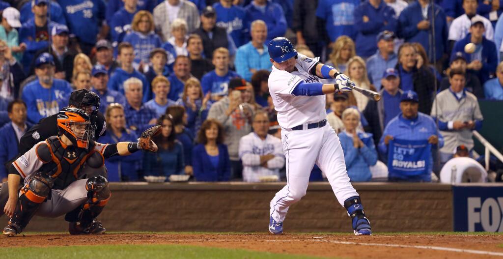 Kansas City Royals batter Billy Butler hits a double to deep right center, allowing Eric Hosmer to score in the second inning during the sixth game of the World Series in Kansas City, Tuesday Oct. 28, 2014 (Christopher Chung) 2014