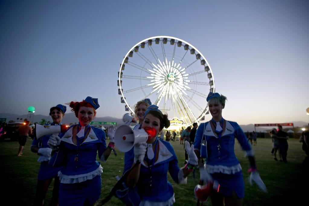 The theater group Bijoulette Airlines performs on the grounds of the Coachella Music and Arts Festival in Indio, Calif., on Friday, April 15, 2016. (Luis Sinco/Los Angeles Times/TNS)