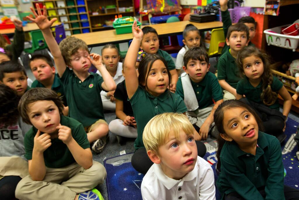 Kindergarten students listen to directions from their teacher at Cesar Chavez Language Academy, a charter school on the Comstock Middle School campus. (photo by John Burgess/The Press Democrat)