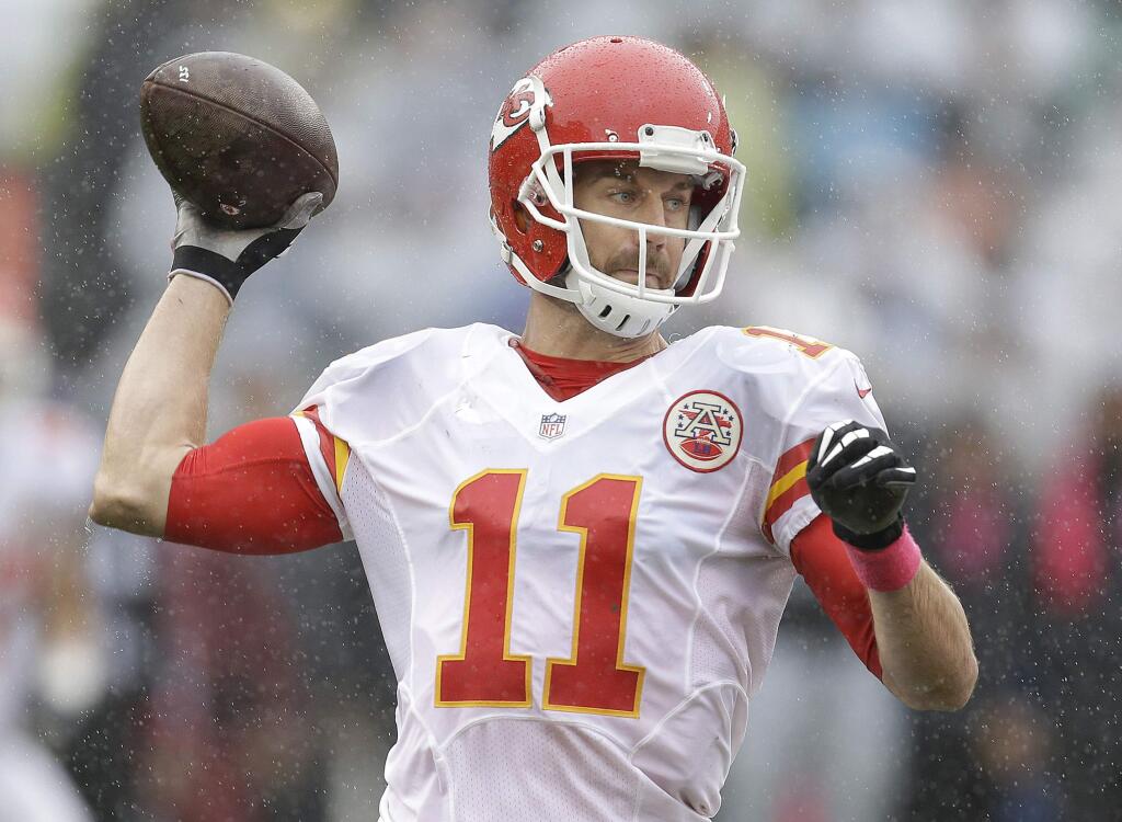 Kansas City Chiefs quarterback Alex Smith (11) passes against the Oakland Raiders during the first half of an NFL football game in Oakland, Calif., Sunday, Oct. 16, 2016. (AP Photo/Ben Margot)