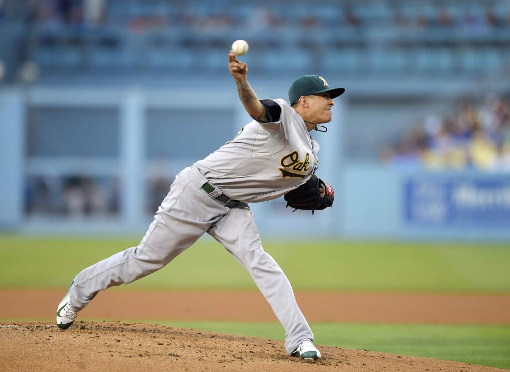 Oakland Athletics starting pitcher Jesse Chavez throws to the plate during the first inning of a baseball game against the Los Angeles Dodgers, Wednesday, July 29, 2015, in Los Angeles. (AP Photo/Mark J. Terrill)