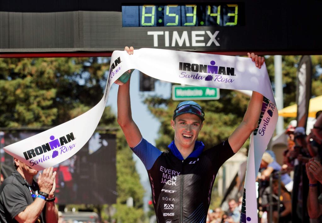 Nicholas Noone crosses the finish line to win the Ironman Santa Rosa after completing the course in 8:53. (John Burgess/The Press Democrat)