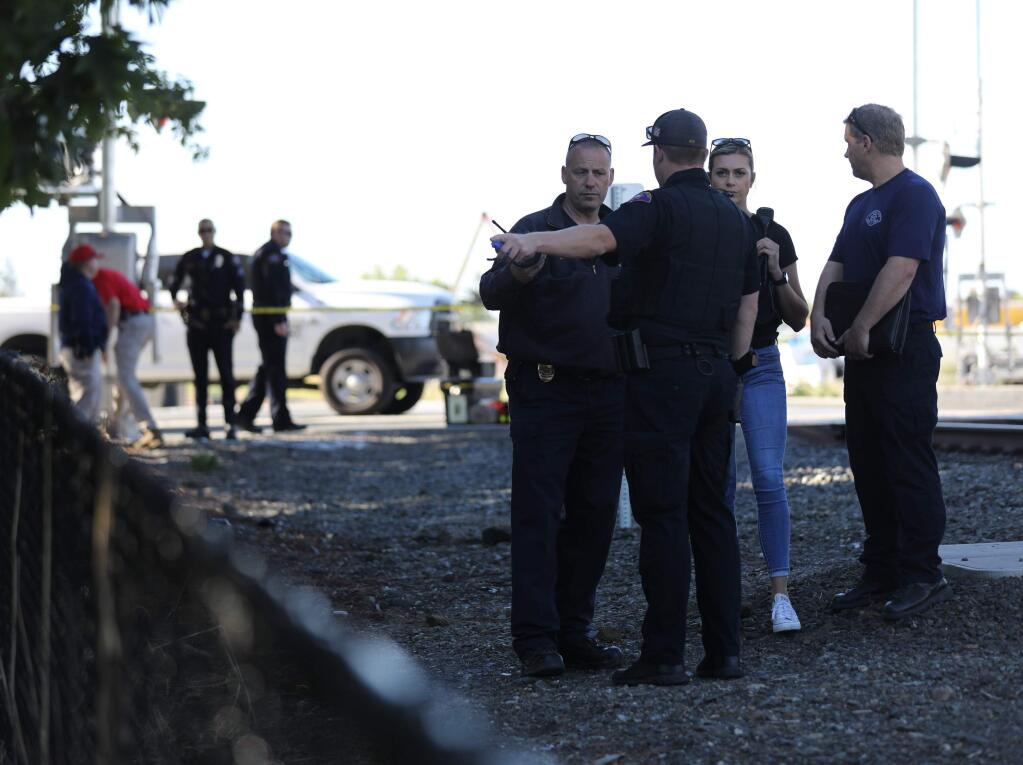 Police investigate the scene where a pedestrian was struck and killed by a SMART train in Rohnert Park on Thursday, June 27, 2019. (BETH SCHLANKER/ PD)