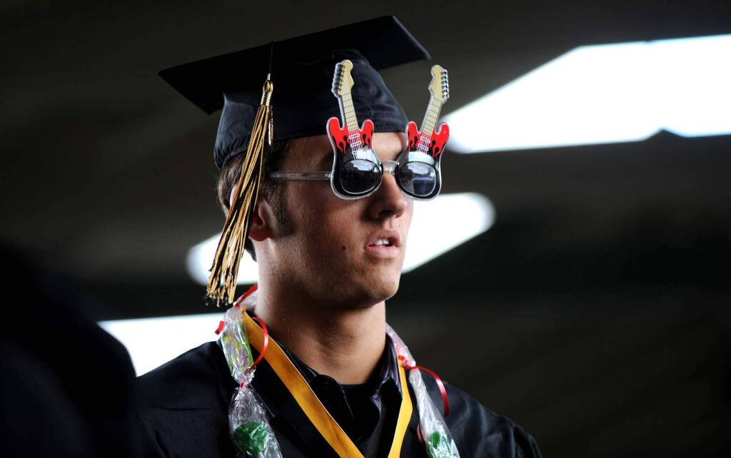 Collin Giddings sports clever eyewear at the 2011 Windsor High School graduation ceremony in Windsor. (Photo: Erik Castro/for The Press Democrat)