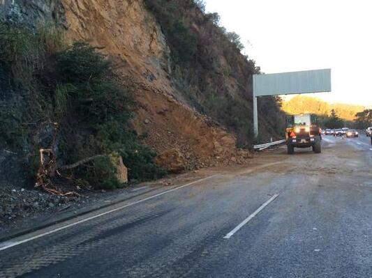 Emergency crews work at the scene of a landslide on Highway 101 in Marin County on Monday, Dec. 22, 2014. (@CHPMARIN)
