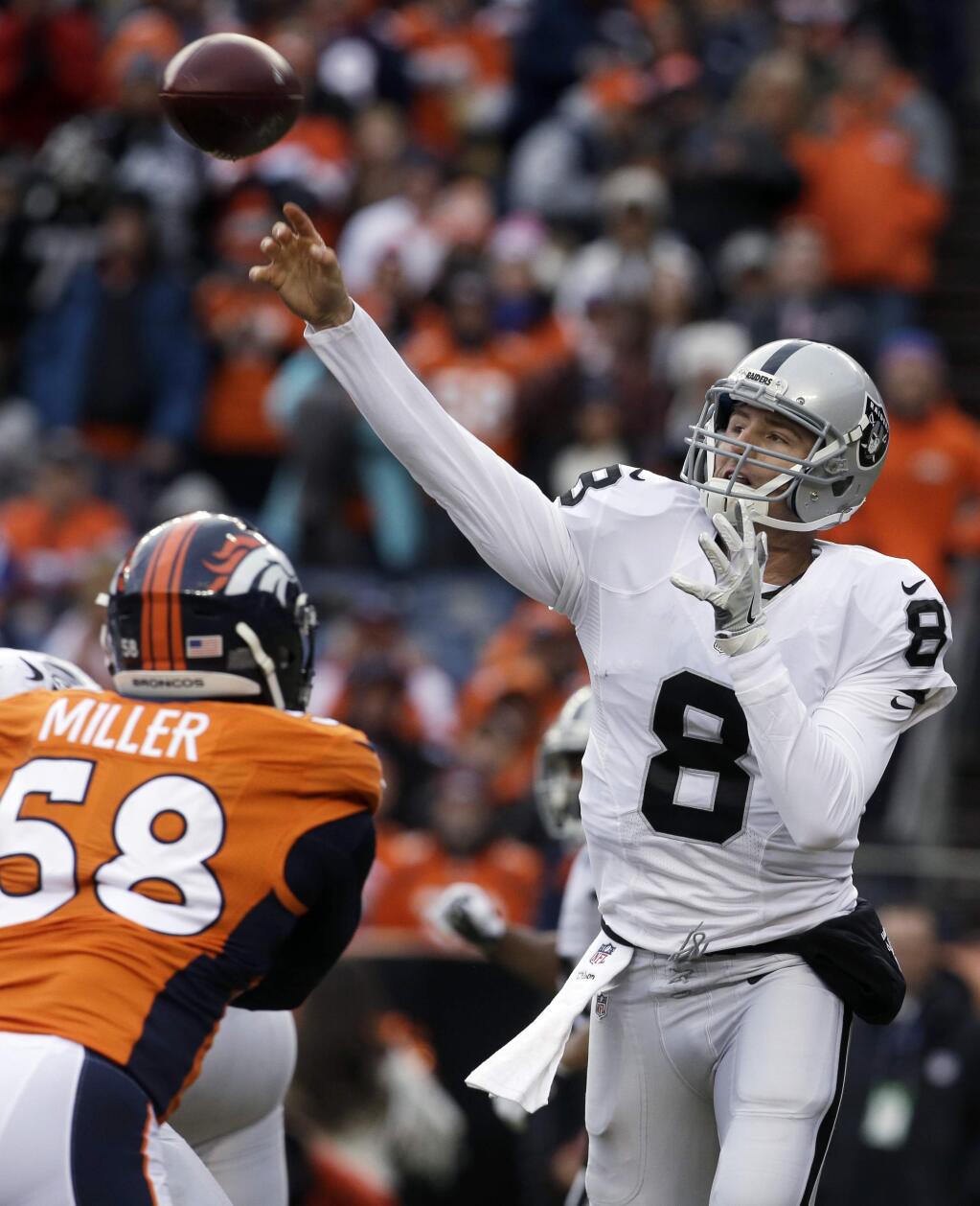 Oakland Raiders quarterback Connor Cook passes against the Denver Broncos during the first half unday, Jan. 1, 2017, in Denver. Cook came into the game after Raiders quarterback Matt McGloin was injured. (AP Photo/Joe Mahoney)