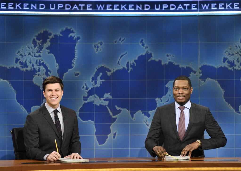 In this March 4, 2017 photo provided by NBC, Colin Jost and Michael Che, right, appear during Weekend Update segment of 'Saturday Night Live' in New York. 'Saturday Night Live' will broadcast live simultaneously across the U.S. for its final four shows of the season, NBC announced Thursday, March 16. Until now, viewers in the Mountain and Pacific time zones have seen the show not as it aired ‚Äúlive from New York,‚Äù but on tape delay. The new live-for-all policy will apply to episodes telecast April 15, May 6, 13 and 20. (Will Heath/NBC via AP)