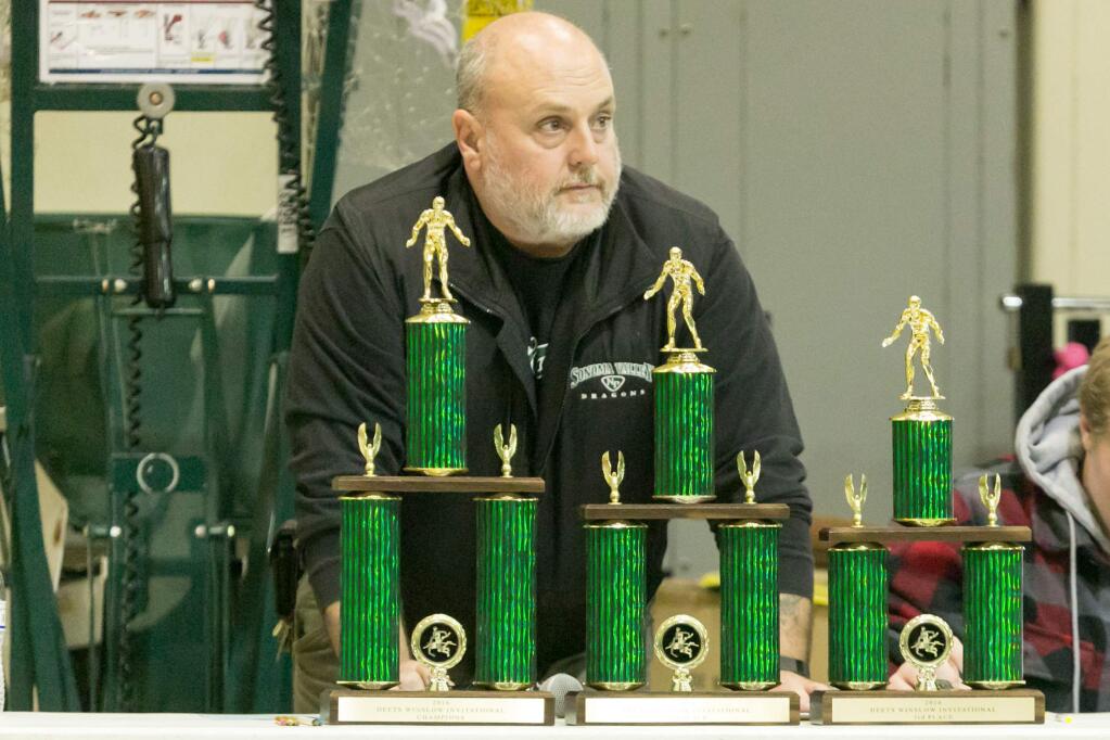 DRAGON WRESTLING Head Coach Tony Albini watches his team and the trophis at the Deets Winslow Invitational at SVHS's Pfieffer Gym, Saturday, Jan. 9, 2016. (Photo by Julie Vader/Special to the Index-Tribune)