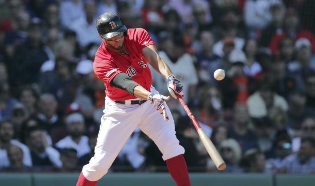 Boston Red Sox's Xander Bogaerts connects for a two RBI single during the second inning of a baseball game against the San Francisco Giants at Fenway Park in Boston, Thursday, Sept. 19, 2019. (AP Photo/Charles Krupa)
