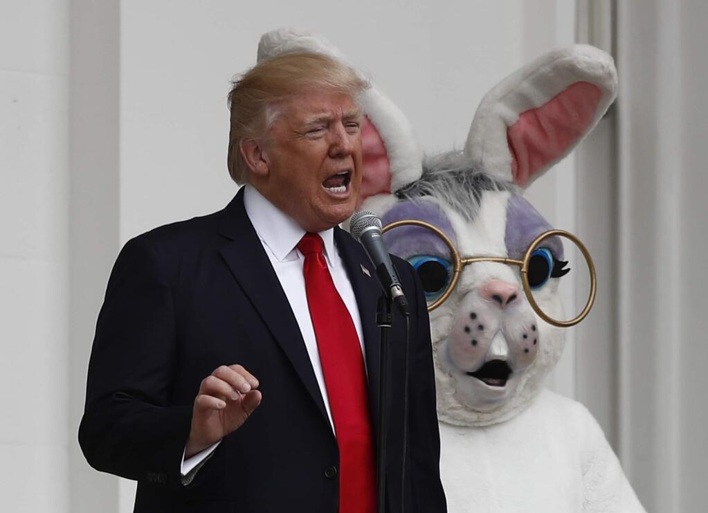 President Donald Trump, speaking at the White House Easter egg roll in 2018, says he wants the country “opened up and just raring to go” by Easter. (CAROLYN KASTER / Associated Press, 2018)